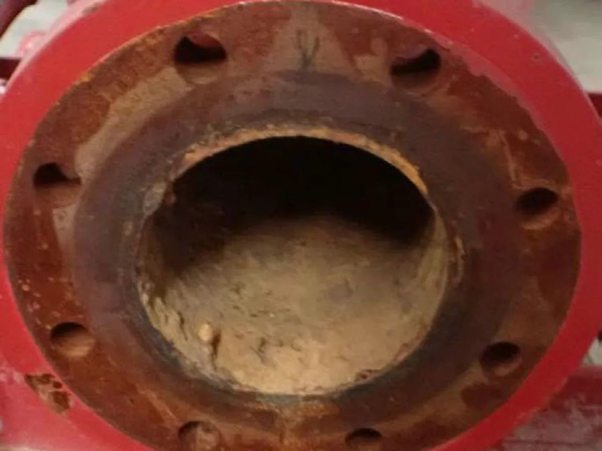 Fire-system pipe-flange field image before cleaning