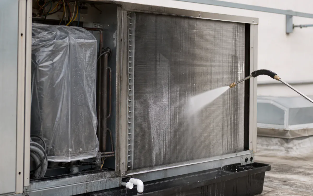 Fin-safe low-pressure cleaning on an isolated aluminum condenser coil