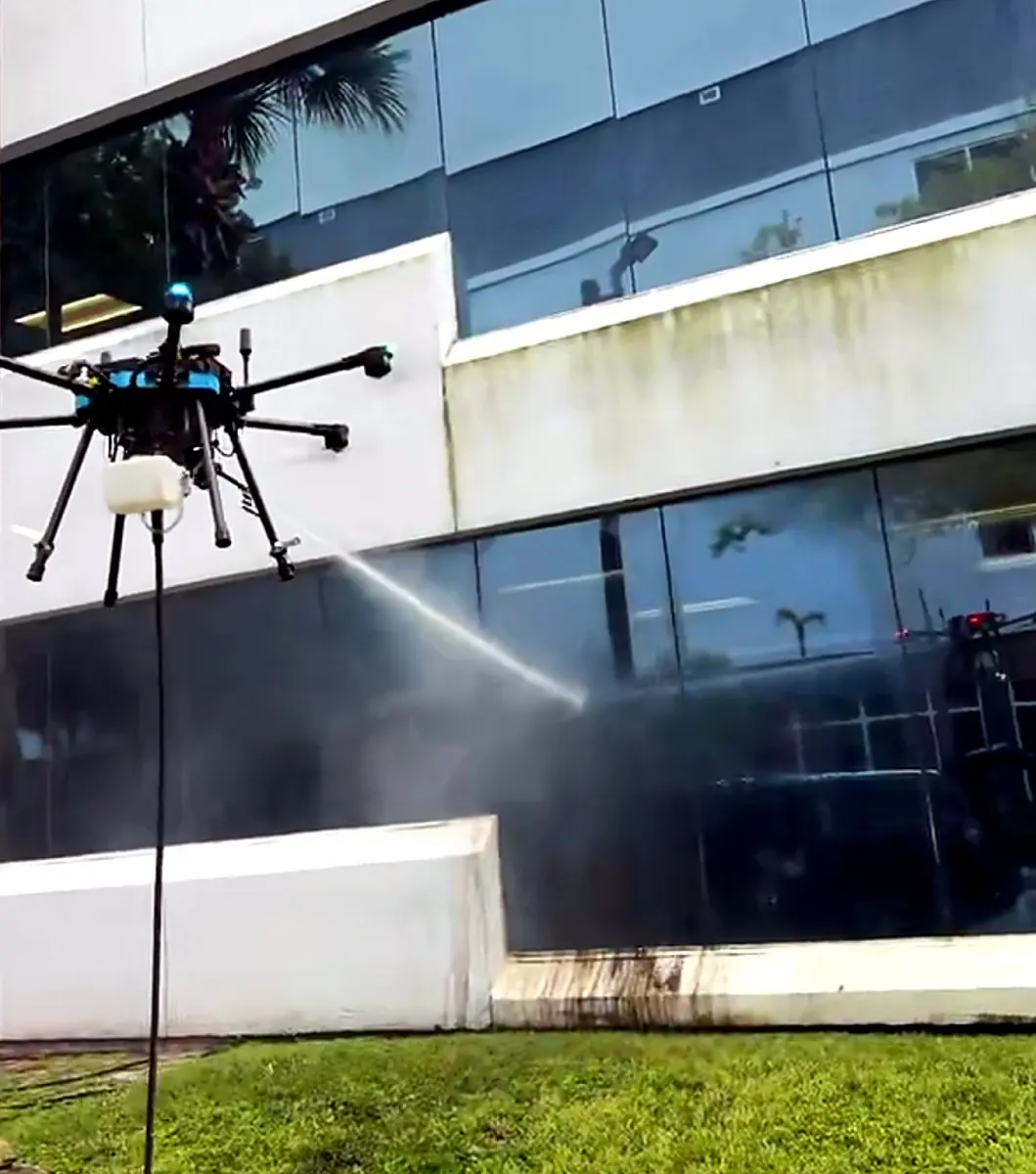 Drone-applied VertKleen building wash in progress